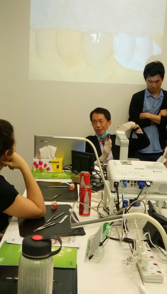 Dr Chong Isaac giving a presentation and hands-on workshop on Tooth Coloured Bonding and Fillings to dentists