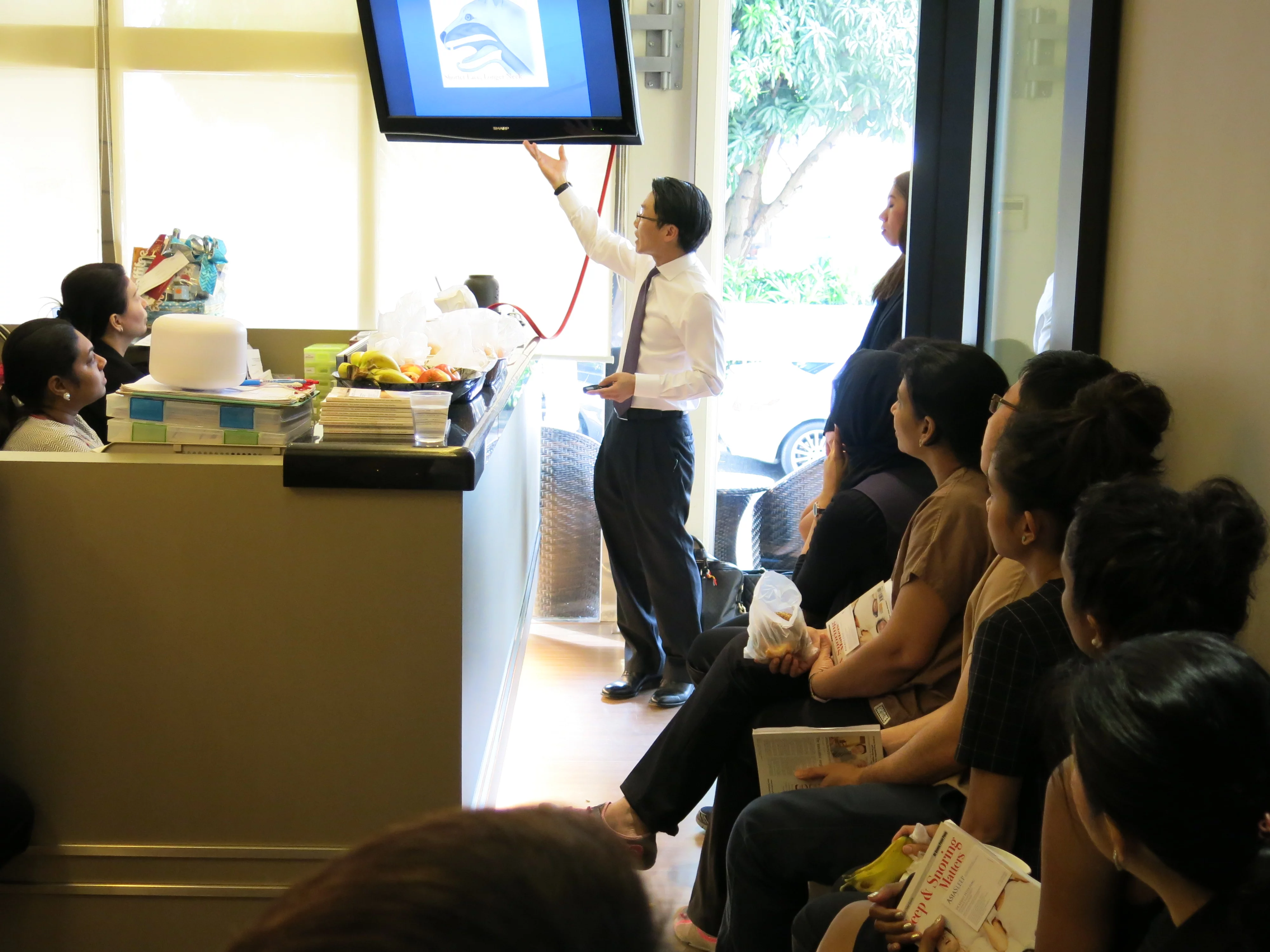 Dr Kenny Pang (ENT and Sleep Specialist) giving a talk  to the Canaan Team.